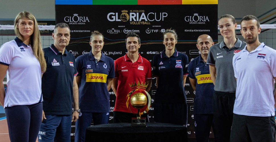 Team coaches and captains with Gloria Cup 2019 Volleyball championship trophy.